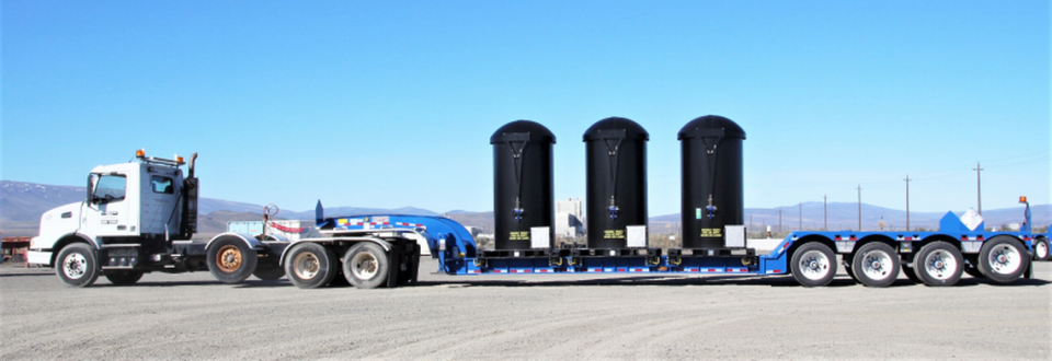 A specially designed truck and trailer will be used to haul glassified low activity radioactive waste containers to a Hanford lined landfill. Now it is being used to haul containers with practice glass and no radioactive waste to a landfill in Oregon.