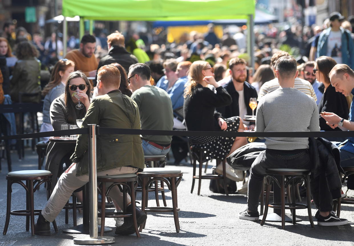 People drink and eat in outdoor street dining areas, as lockdown restrictions are eased amidst the spread of the coronavirus disease (COVID-19) pandemic in Soho, London, Britain, April 24, 2021. REUTERS/Toby Melville