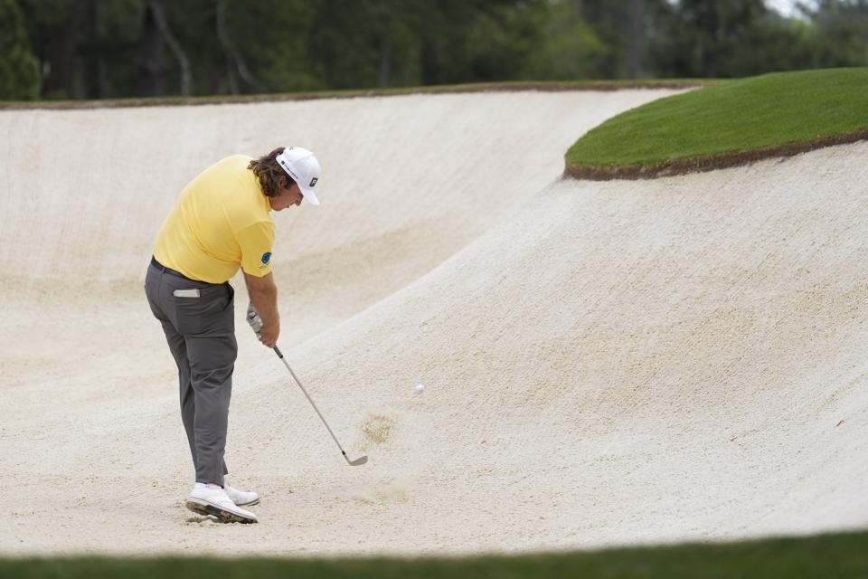 Neal Shipley hits from the bunker on the second hole during the first round at the Masters golf tournament at Augusta National Golf Club Thursday, April 11, 2024, in Augusta, Ga. (AP Photo/Ashley Landis)