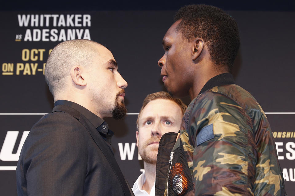 MELBOURNE, AUSTRALIA - AUGUST 15: Robert Whittaker (L) faces off with Israel Adesanya (R) during a UFC Australia press conference at Federation Square on August 15, 2019 in Melbourne, Australia. (Photo by Daniel Pockett/Zuffa LLC/Zuffa LLC via Getty Images)