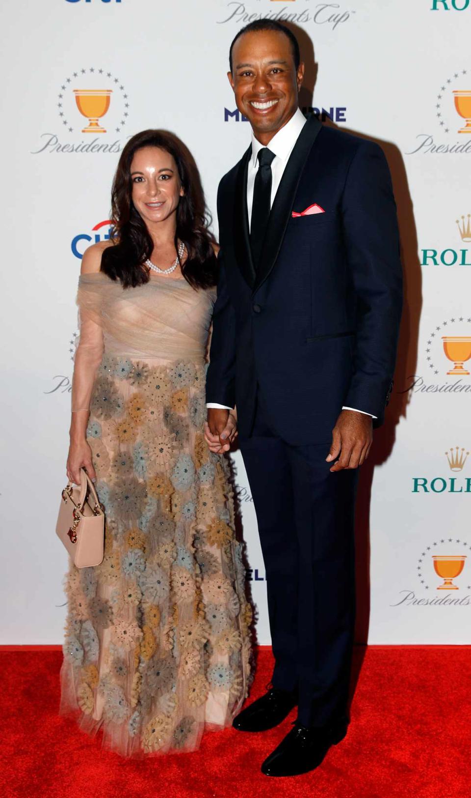 Tiger Woods with his girlfriend, Erica Herman, pose on the red carpet during the Presidents Cup Gala prior to Presidents Cup at The Royal Melbourne Golf Club on December 10, 2019, in Melbourne, Australia.