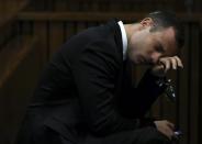 Oscar Pistorius attends his trial at the high court in Pretoria April 7, 2014. REUTERS/Themba Hadebe/Pool