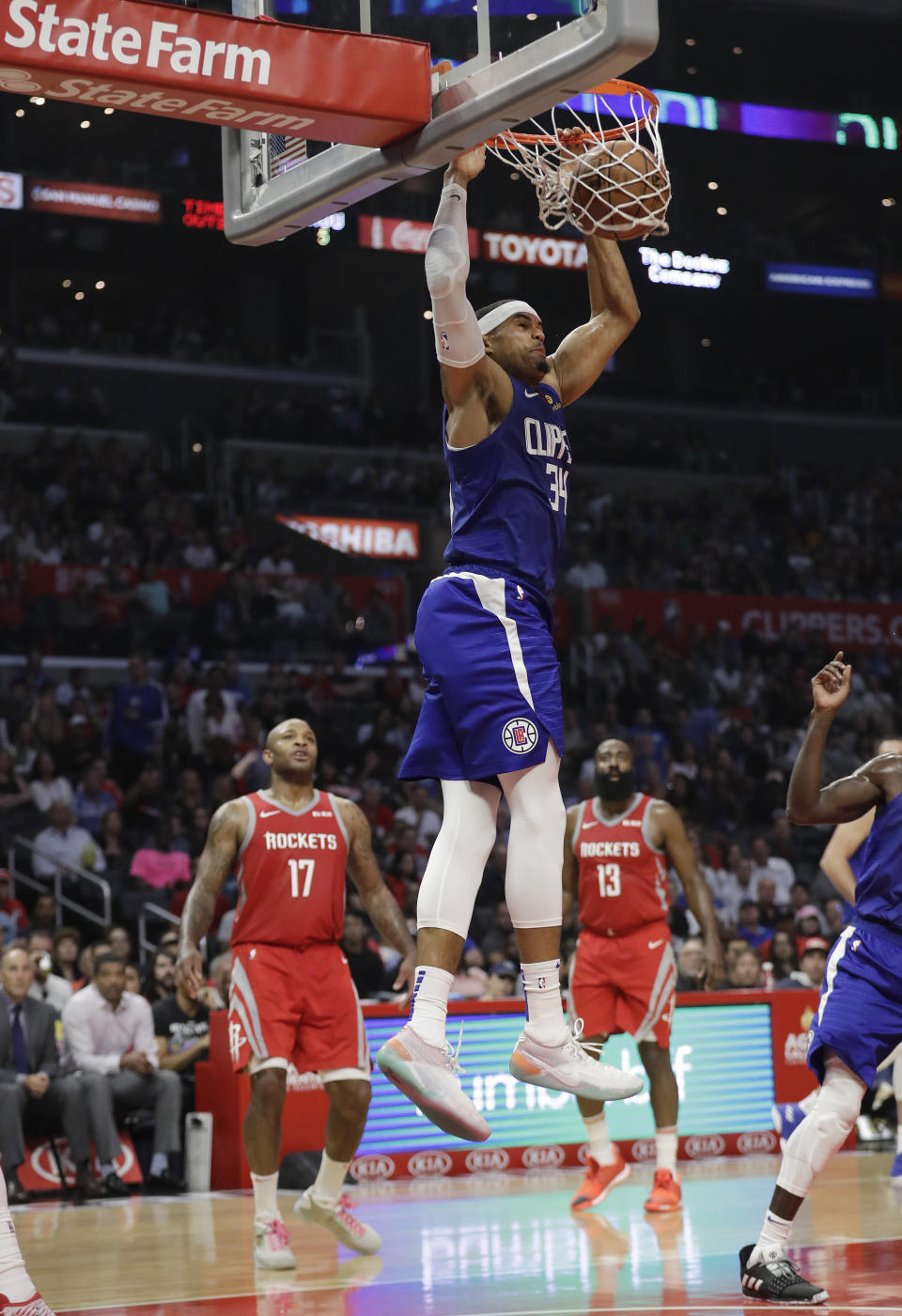 Los Angeles Clippers' Tobias Harris (34) dunks against the Houston Rockets during the first half of an NBA basketball game Sunday, Oct. 21, 2018, in Los Angeles. (AP Photo/Marcio Jose Sanchez)