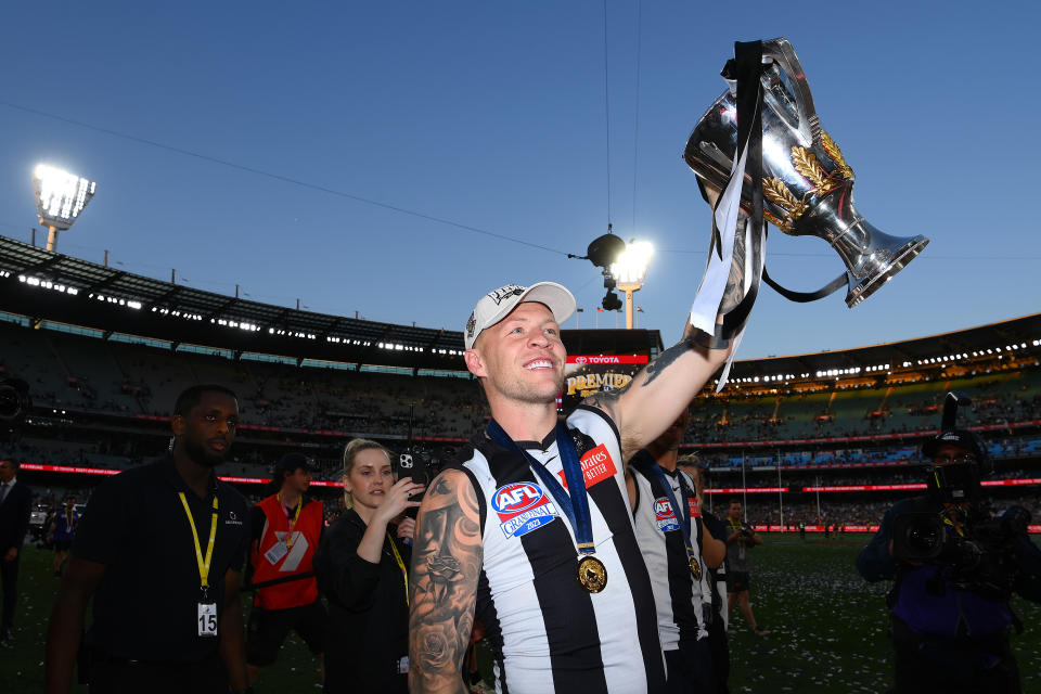 MELBOURNE, AUSTRALIA - SEPTEMBER 30: Jordan De Goey of the Magpies celebrates winning with the AFL Premiership Cup during the 2023 AFL Grand Final match between Collingwood Magpies and Brisbane Lions at Melbourne Cricket Ground, on September 30, 2023, in Melbourne, Australia. (Photo by Quinn Rooney/Getty Images)