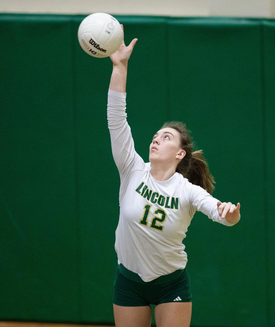 Lincoln setter Ashlyn Koerner (12) serves the ball. The Florida High Seminoles swept the Lincoln Trojans on Tuesday, Sept. 20, 2022.