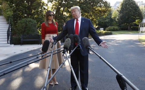 Donald Trump gesture while telling the media the UK was in "somewhat turmoil" on the South Lawn of the White House on Tuesday - Credit: Yuri Gripas/Bloomberg