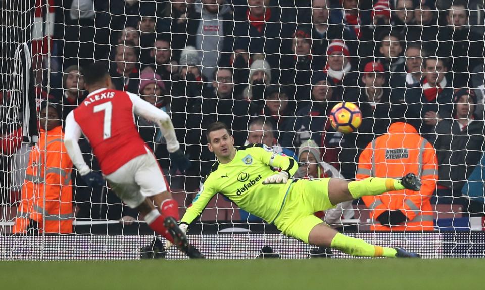 <p>Alexis Sanchez chips the ball down the middle of the goal to score the winner from the penalty spot. </p>