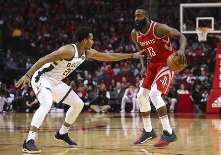 Dec 16, 2017; Houston, TX, USA; Houston Rockets guard James Harden (13) dribbles the ball as Milwaukee Bucks guard Rashad Vaughn (20) defends during the second quarter at Toyota Center. Mandatory Credit: Troy Taormina-USA TODAY Sports