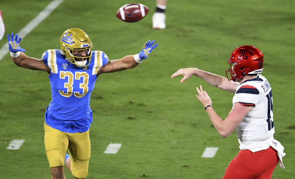 UCLA linebacker Bo Calvert pressures Arizona quarterback Will Plummer during the first half of an NCAA college football game Saturday, Nov. 28, 2020, in Pasadena, Calif. (Keith Birmingham/The Orange County Register via AP)