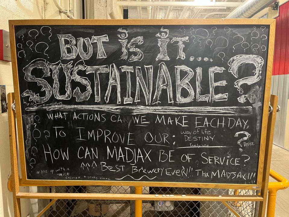 A blackboard placed right by the entrance of the Madjax Maker Force building in Muncie, Indiana. The phrase “wake up with a smile” has been written in the corner by Carolyn, a 91-year-old woman and a mother to one of the board members of Sustainable Muncie.