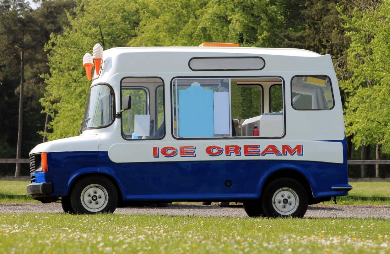 ice cream van parked in green countryside