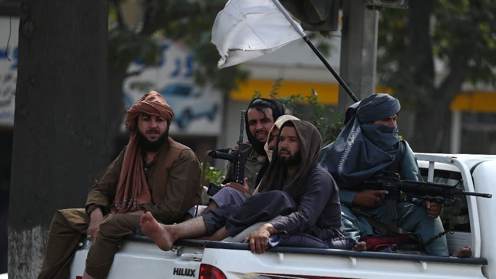 Taliban militants patrol Kabul