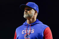 Chicago Cubs manager David Wade Ross returns to the dugout after making a pitching change during the eighth inning of a baseball game against the Cincinnati Reds, Monday, Oct. 3, 2022, in Cincinnati. (AP Photo/Jeff Dean)