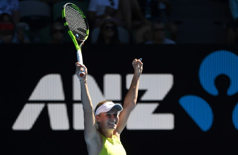 Denmark's Caroline Wozniacki produced a great escape against little-known Croat Jana Fett, rallying from 5-1 down in an epic third set to to keep her dream of a first Grand Slam title alive 3-6, 6-2, 7-5