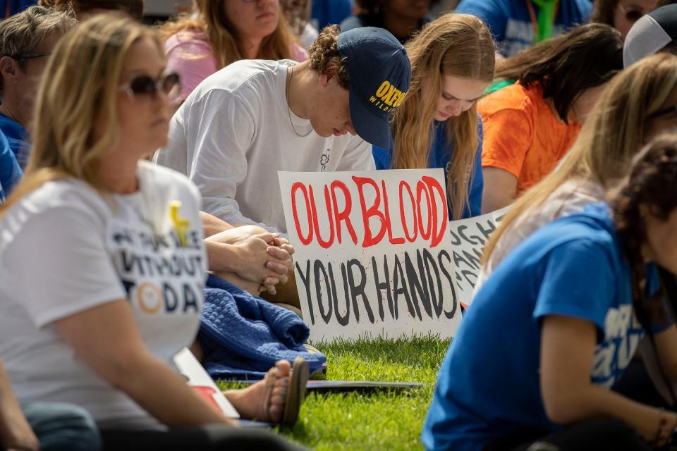 Emotions are still strong in Oxford as people fill Centennial Park in Oxford to listen to speakers before they marched to Oxford High School and back for the March For Our Lives Oxford event on Saturday, June 11, 2022. Students, teachers and parents shared their stories of loss following the shooting at the school and demanded that lawmakers enact gun control laws to keep these tragedies from happening again.