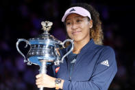 Tennis - Australian Open - Women's Singles Final - Melbourne Park, Melbourne, Australia, January 26, 2019. Japan's Naomi Osaka poses with her trophy after winning her match against Czech Republic's Petra Kvitova. REUTERS/Kim Kyung-Hoon