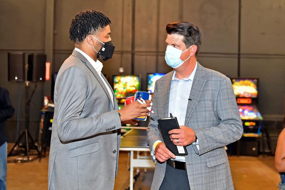 State Rep. Torrey Harris, D-Memphis, talks with Jason Martin during a July 2021 event in Memphis.