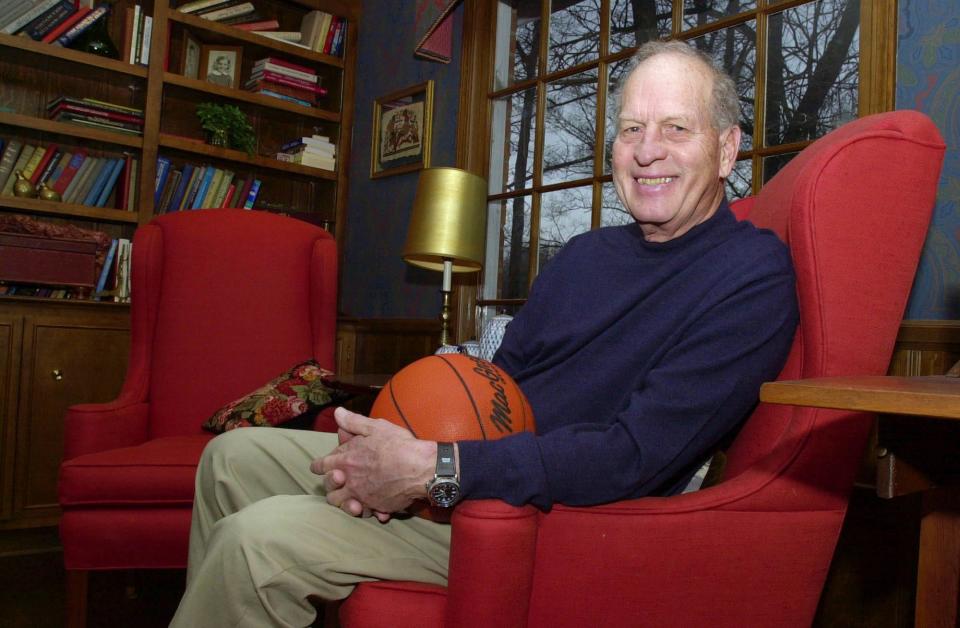 Frank Selvy poses with a basketball that belongs to his  son, Mike, at his home Thursday, Feb. 5, 2004, in Simpsonville, S.C. Fifty years after scoring his recorded 100 points against Newberry College, he and his surviving teammates will take part in a ceremony honor that 100-point game on Feb. 21 during Furman's game against The Citadel at Timmons Arena. (AP Photo/Mary Ann Chastain)
