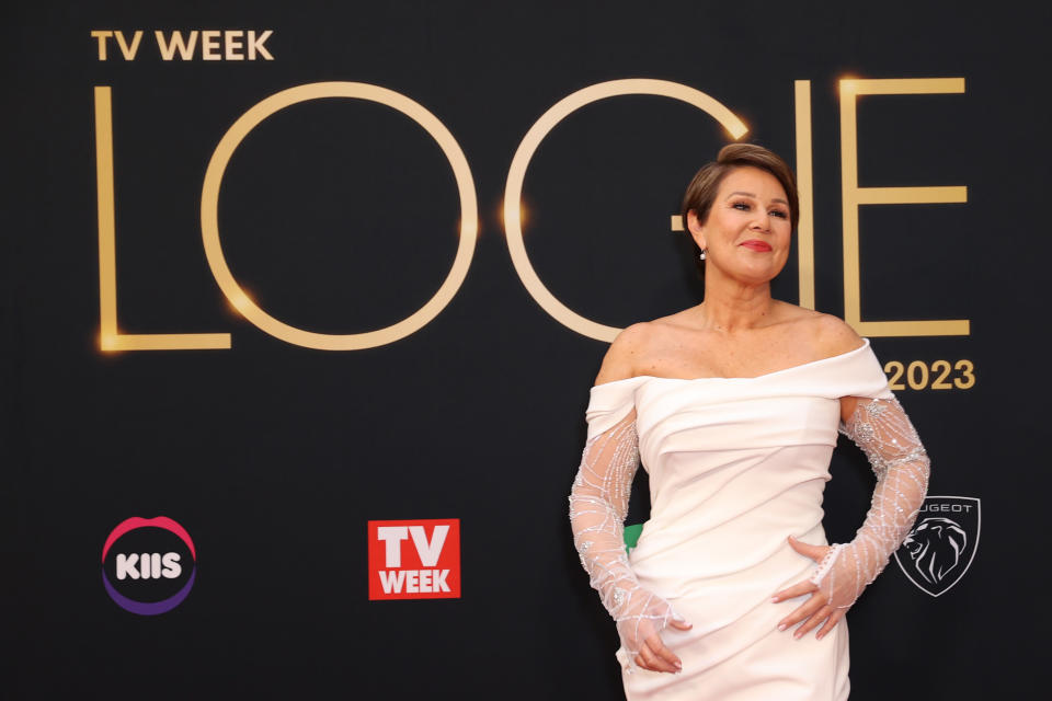 Julia Morris at the 2023 Logie awards on the red carpet in a white gown