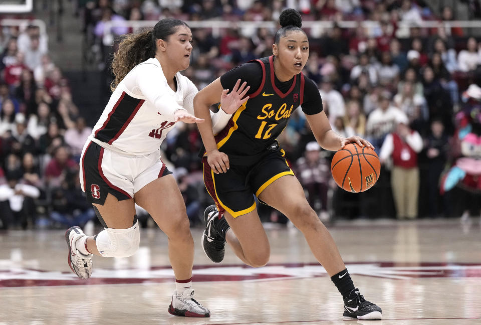 PALO ALTO, CALIFORNIA – FEBRUARY 02: JuJu Watkins #12 of the USC Trojans drives towards the basket past Talana Lepolo #10 of the Stanford Cardinal in the second quarter at Stanford Maples Pavilion on February 02, 2024 in Palo Alto, California. (Photo by Thearon W. Henderson/Getty Images)