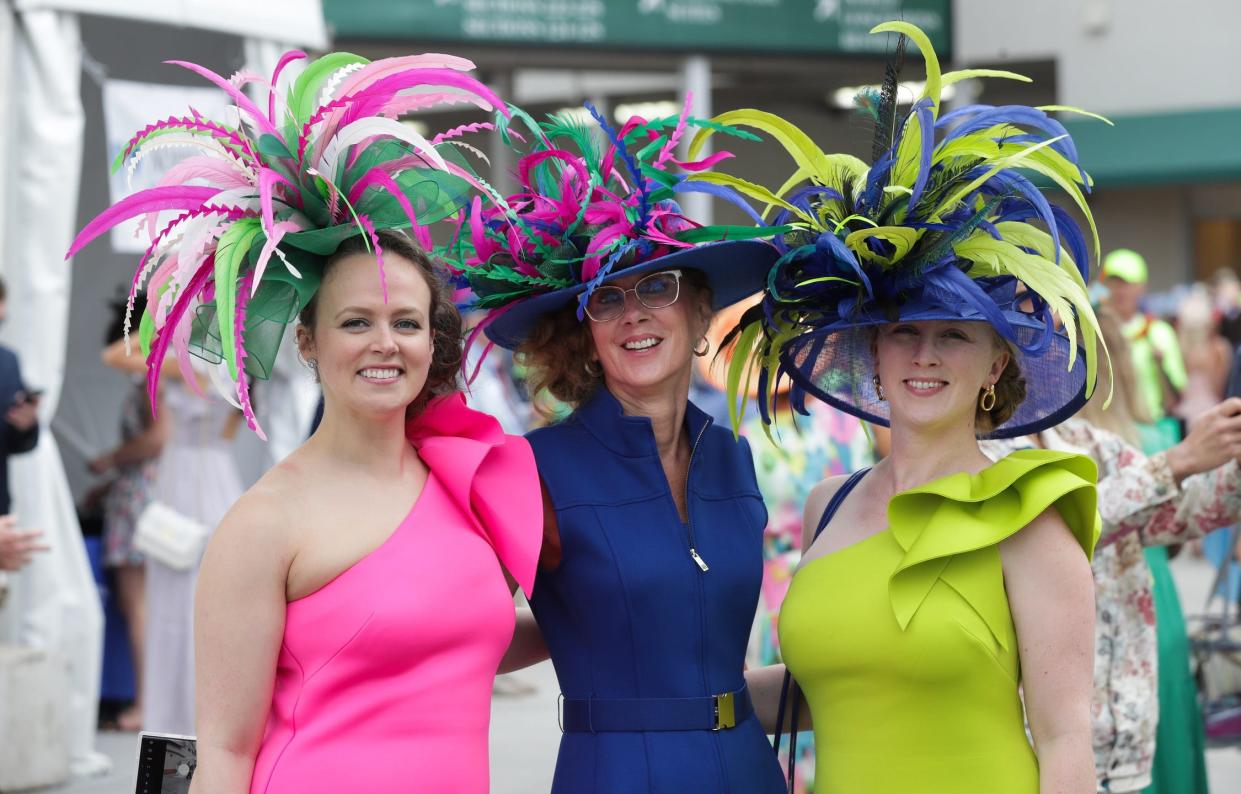 May 4, 2024; Louisville, KY, USA; Women pose with their complimentary Derby hats during the Kentucky Derby in Louisville, Ky. on May. 4 2024. Mandatory Credit: Sam Upshaw, Jr.-USA TODAY Sports