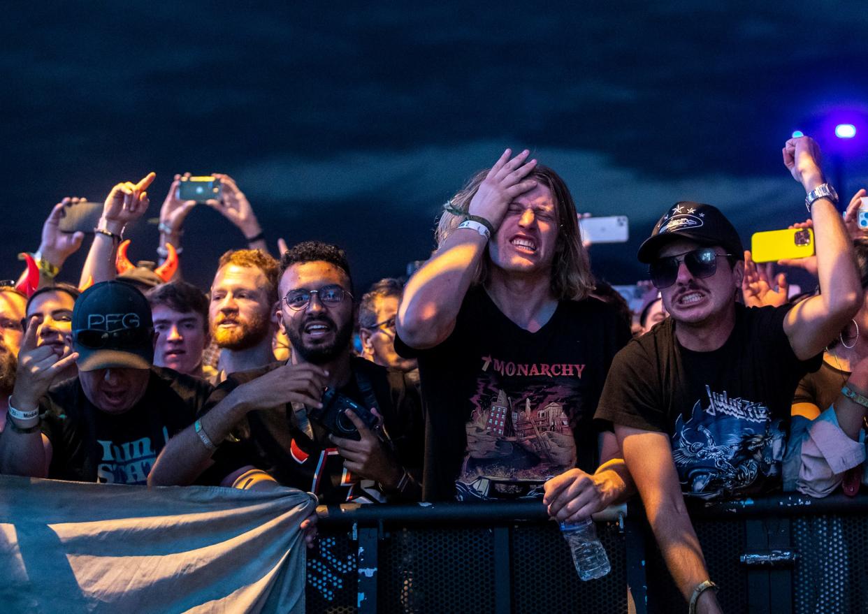 Festivalgoers rock out to Judas Priest as they start their set during the Power Trip Music Festival at the Empire Polo Club in Indio, Calif., Saturday, Oct. 7, 2023.