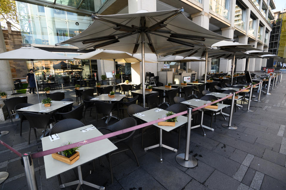 Empty tables at a restaurant in Circular Quay, Sydney. Source: AAP