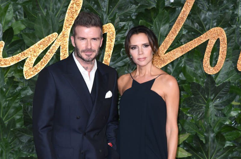 David Beckham (L) and Victoria Beckham attend the Fashion Awards in London in 2018. File Photo by Rune Hellestad/UPI