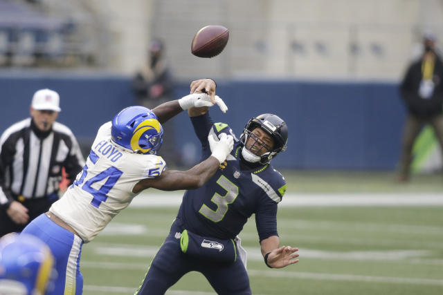 Los Angeles Rams outside linebacker Leonard Floyd (54) knocks the ball away as Seattle Seahawks quarterback Russell Wilson tries to pass. (AP Photo/Scott Eklund)