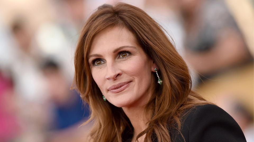 Julia Roberts is pictured with red hair as she arrives at the 21st Annual Screen Actors Guild Awards at The Shrine Auditorium on January 25, 2015 in Los Angeles, California.