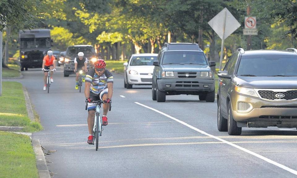 Cyclists ride The Booty Loop course along Queens Road on Wednesday. Photo by David T. Foster III /Charlotte Observer
