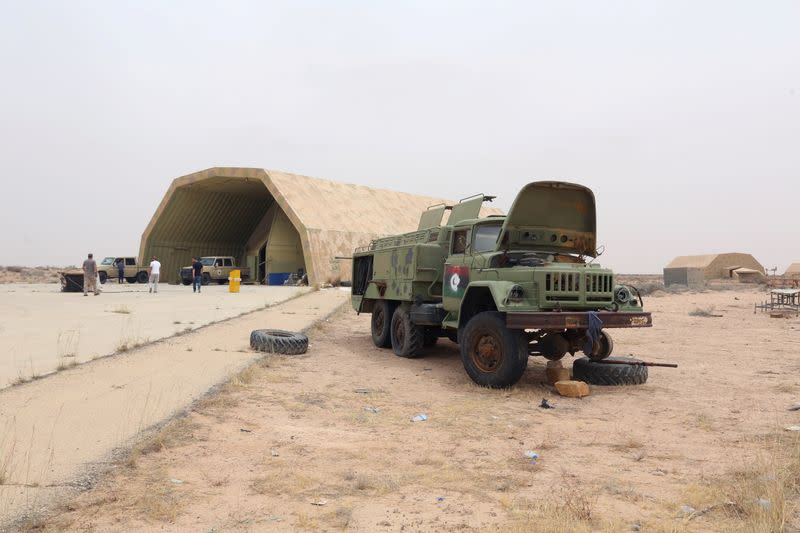 Members of Libya's internationally recognised government are seen after taking control of Watiya airbase near Tripoli