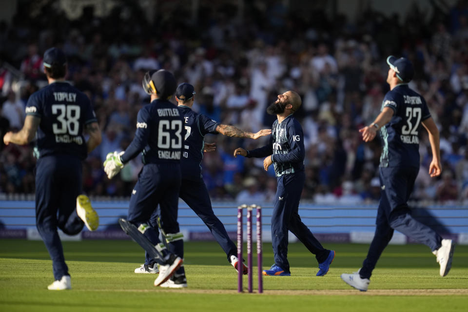 England's Moeen Ali, second right, celebrates taking the wicket of India's Hardik Pandya during the second one day international cricket match between England and India at Lord's cricket ground in London, Thursday, July 14, 2022. (AP Photo/Matt Dunham)