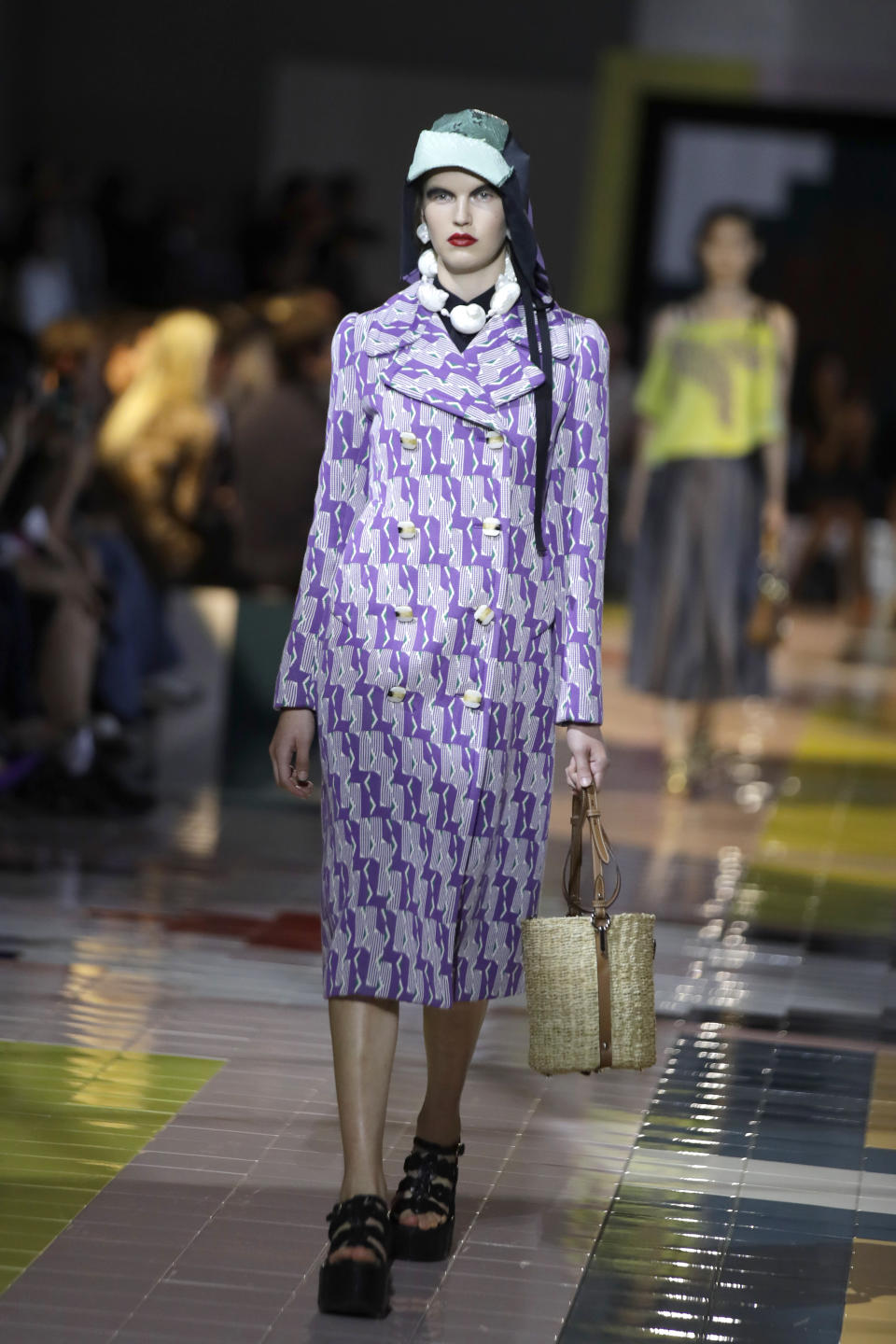 A model wears a creation as part of the Prada Spring-Summer 2020 collection, unveiled during the fashion week, in Milan, Italy, Wednesday, Sept. 18, 2019. (AP Photo/Luca Bruno)