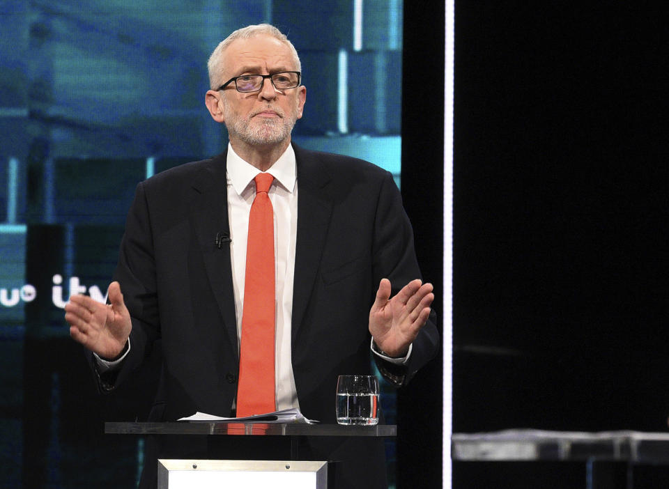 In this photo issued by ITV, Jeremy Corbyn reacts during the election head-to-head debate live on TV, in Salford, Manchester, England, Tuesday, Nov. 19, 2019. Prime Minister Boris Johnson and opposition Labour Party leader Jeremy Corbyn are going head-to-head in their first live televised debate Tuesday evening, as the UK prepares for a General Election on Dec. 12. (ITV via AP)