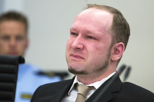 Rightwing extremist Anders Behring Breivik, who killed 77 people in twin attacks in Norway last year, shares a tear as court views propaganda film he made, during his trial in Oslo courthouse
