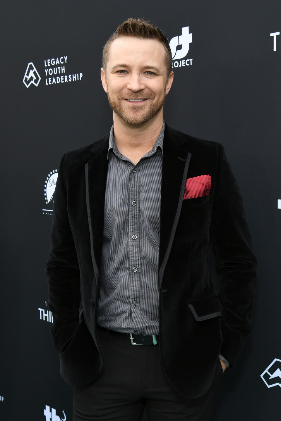 closeup of him in a velvet blazer for an event