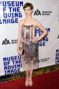 Following disappointing red carpet appearances at the New York and London premieres of "Les Miserables," Anne Hathaway righted her style ship at Tuesday evening's Hugh Jackman tribute, hosted by the Museum of Moving Images. What do you make of the big screen star's sequined, spaghetti-strapped Nina Ricci cocktail frock and shimmering Stella McCartney sandals? Hot or not? (12/11/2012)