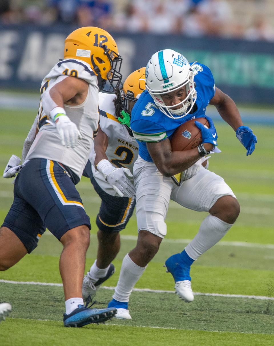 West Florida's Shomari Mason runs down field during the inaugural football season at Pen Air Field the the University of West Florida, Saturday, September 3, 2022.