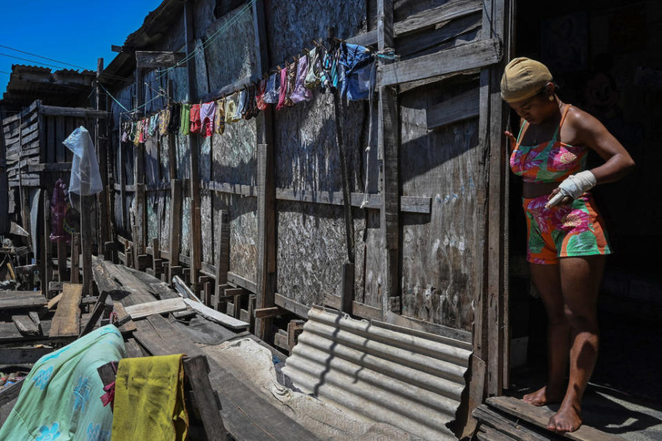 A woman stands at the doorway of her house at the Coelho favela on the banks of Capibaribe river in Recife, Pernambuco, northeast Brazil, on Sept. 10, 2022. Some 33.1 million Brazilians live in hunger, an issue looming large in October presidential elections.<span class="copyright">NELSON ALMEIDA/AFP via Getty Images</span>