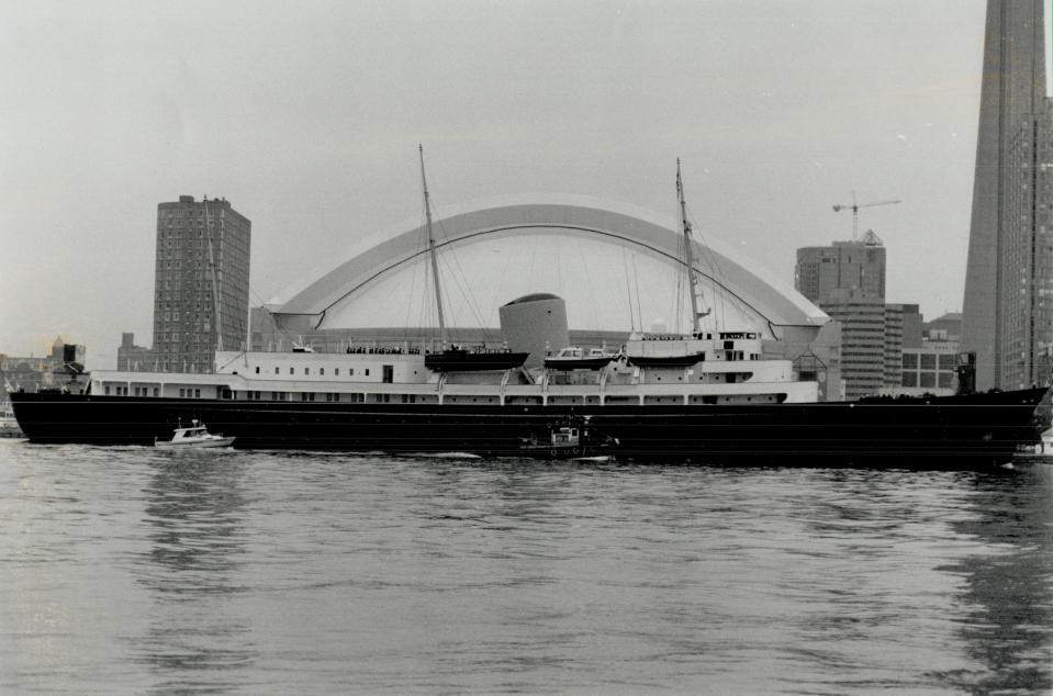 October 21, 1989: The Royal Yacht Britannia sails past the SkyDome to berth at the foot of Sherbourne St. for a six-day stint as home base for the visiting royal couple. (Photo by Boris Spremo/Toronto Star via Getty Images)