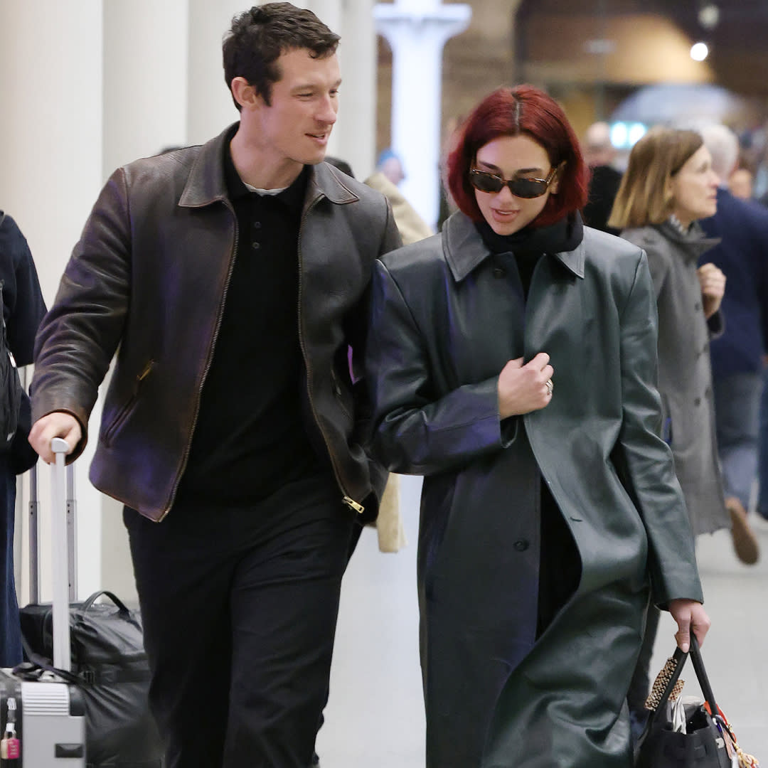  Callum Turner and Dua Lipa travel together with luggage in London. 