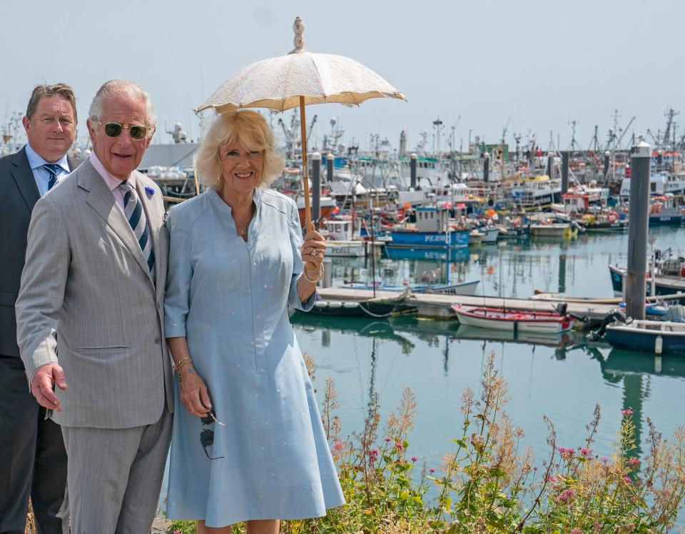 Prince Charles, Prince of Wales and Camilla, Duchess of Cornwall visit Newlyn Harbour and fishing port near Penzance on the first day of their annual visit to the South West on July 18, 2022 in Newlyn, United Kingdom. The Duke and Duchess of Cornwall are on a 3-day visit to the southwestern region to celebrate the Prince of Wales' 70th year as the Duke of Cornwall.