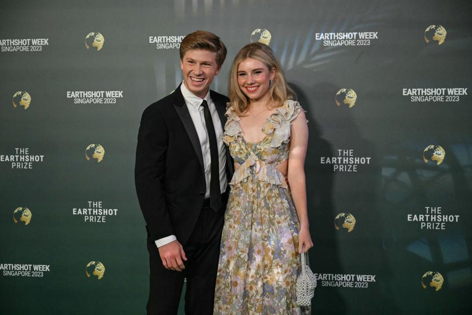 Australian wildlife conservationist Robert Irwin (L) and his girlfriend Rorie Buckey (R) pose as they arrive to attend the 2023 Earthshot Prize in Singapore on November 7, 2023. The Prince of Wales will unveil the five winners of the 2023 Prize that aims to reward innovative efforts to combat climate change. (Photo by MOHD RASFAN / AFP) (Photo by MOHD RASFAN/AFP via Getty Images)