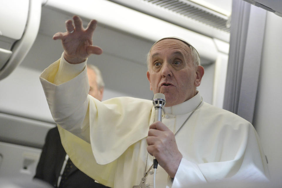 FILE - Pope Francis gestures as he answers reporters questions during a news conference aboard the papal flight on the journey back from Brazil, on July 29, 2013. Pope Francis reached out to gays saying "If someone is gay and he searches for the Lord and has good will, who am I to judge?" Pope Francis' first 10 years as pope have been marked by several historic events, as well as several unplanned moments or comments that nevertheless helped define the contours and priorities of history's first Latin American pope. (AP Photo/Luca Zennaro, Pool, File)