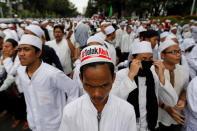 <p>Hard-line Muslim groups block a street during a protest against Jakarta’s incumbent governor, Basuki Tjahaja Purnama (Ahok), an ethnic Chinese Christian running in the upcoming election, in Jakarta, Indonesia, Oct. 14, 2016. The sign reads: “Reject Ahok.” (Photo: Beawiharta/Reuters)</p>