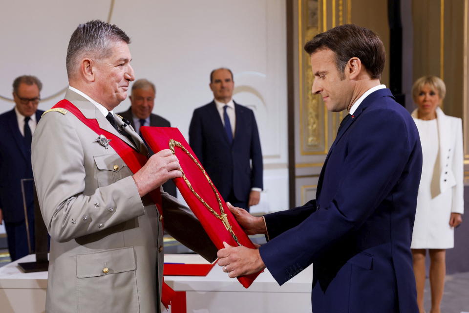 France's Military Chief of Staff to the presidency Benoit Puga, left, and French President Emmanuel Macron attend the ceremony of his inauguration for a second term at the Elysee palace, in Paris, France, Saturday, May 7, 2022. Macron was reelected for five years on April 24 in an election runoff that saw him won over far-right rival Marine Le Pen. (Gonzalo Fuentes/Pool via AP)