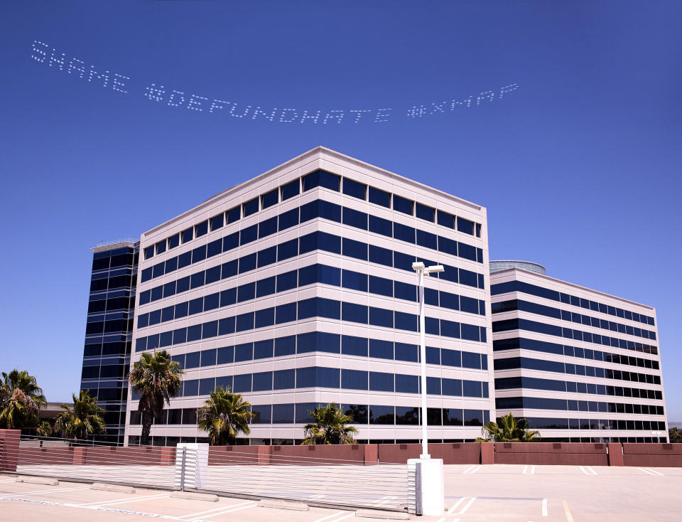 The skytyped phrase "#SHAME #DEFUND HATE" chosen by artist Cassils is seen over the Geo Group Headquarters during the In Plain Sight day of action on July 3 in Los Angeles. Photo by Robin Black. (Photo: Robin Black)