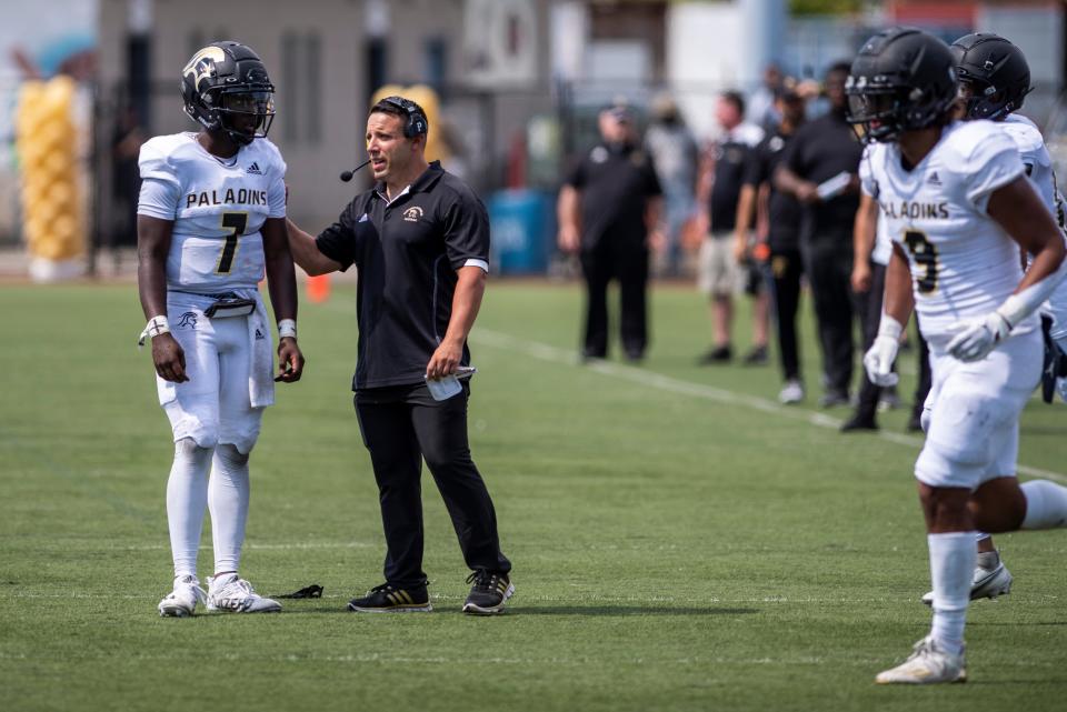 Paramus Catholic Football at Hudson Catholic on Saturday, Sept. 3, 2022. PC head coach Greg Russo talks with #7 Kievon Harper. 