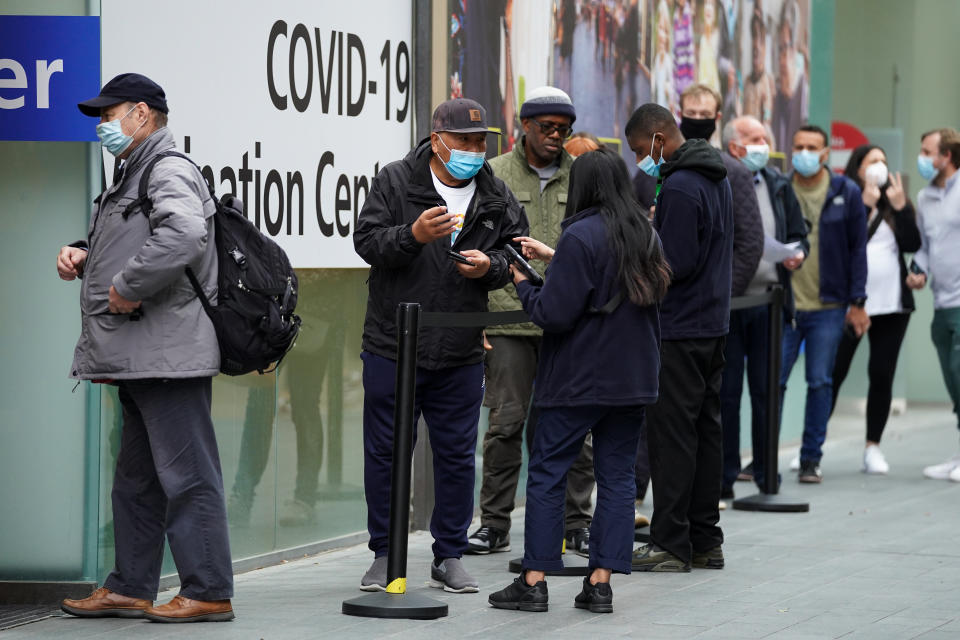 People queue to receive a Covid-19 jab at a pop-up vaccination centre at Westfield Stratford City shopping centre in east London, where TikTok are encouraging young Londoners to get jabbed. Picture date: Saturday October 2, 2021. (Photo by Kirsty O'Connor/PA Images via Getty Images)